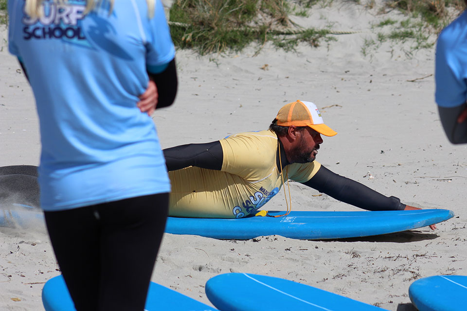 Students learning to surf at Waihi Beach
